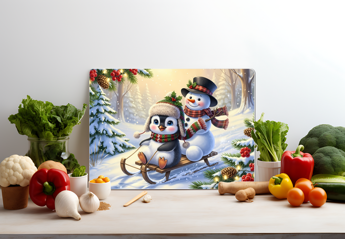 Penguin & Snowman Winter Sled Glass Cutting Board